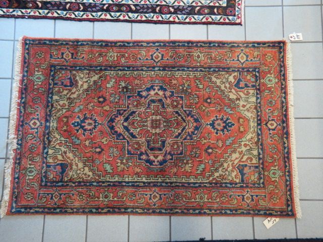 Appraisal: Heriz Persian Handmade Rug geometric central medallion stylized floral borders