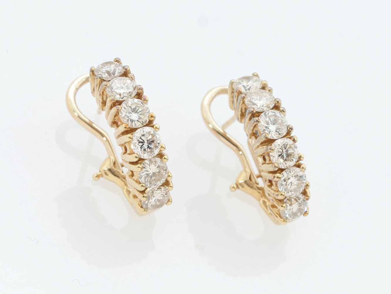 Appraisal: K CTW DIAMOND EARRINGS K yellow gold solitaire earrings contain