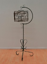 Appraisal: A Victorian brass birdcage on painted wrought iron scrolled stand