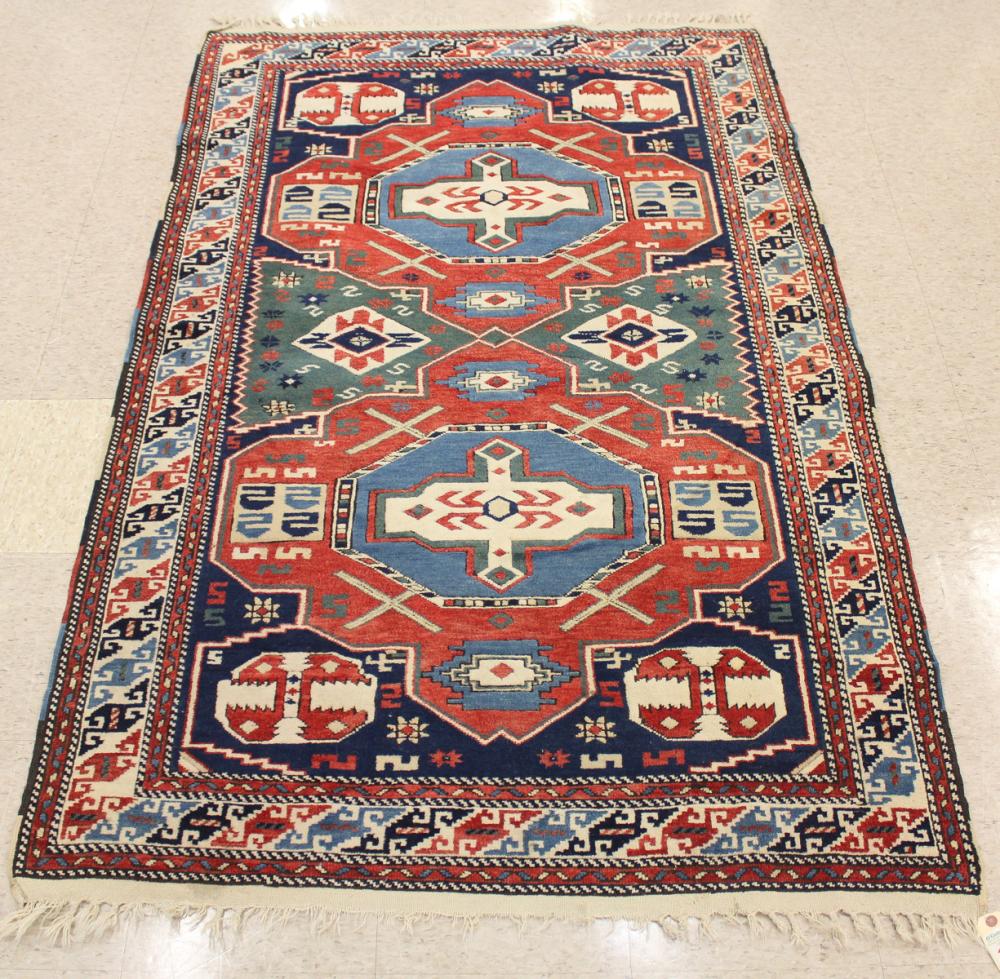 Appraisal: HAND KNOTTED TURKISH CAUCASIAN AREA RUG double geometric medallion design