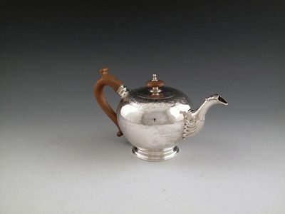 Appraisal: A George II silver tea pot by John Chartier London