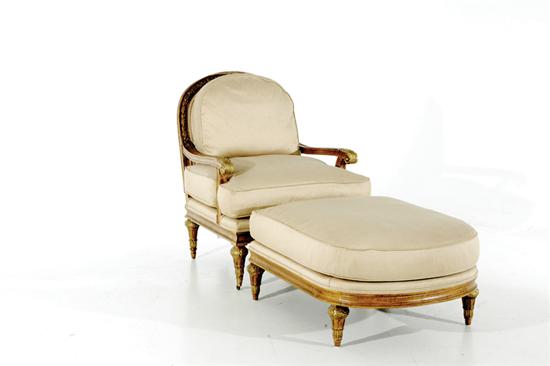 Appraisal: French style carved and gilt-decorated chair and ottoman bead-and-channel frame