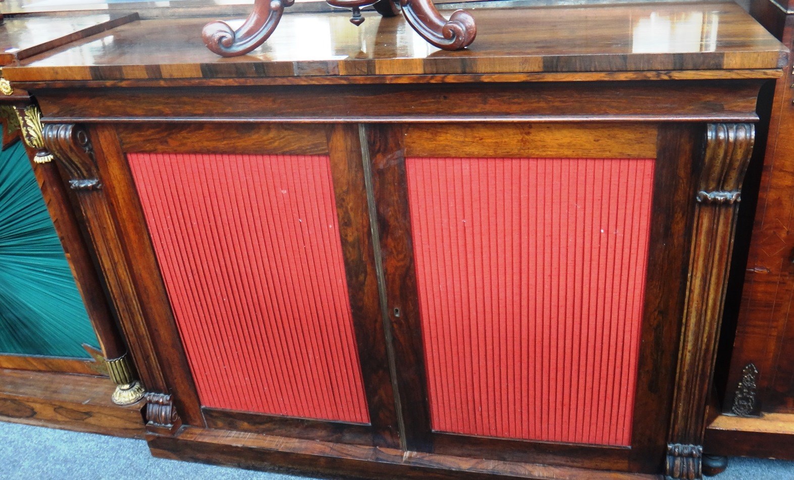 Appraisal: A th century rosewood chiffonier with a pair of pleated