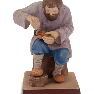 Appraisal: A Russian Porcelain Figure of a Bast Shoe Maker Gardner