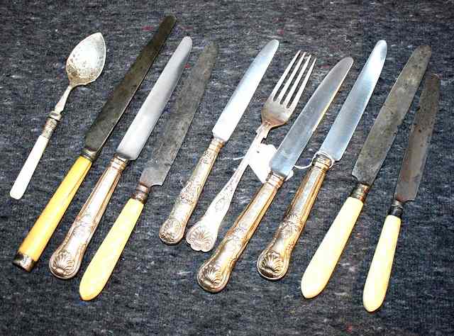 Appraisal: THREE SILVER HANDLED KINGS PATTERN TABLE KNIVES four ivory handled