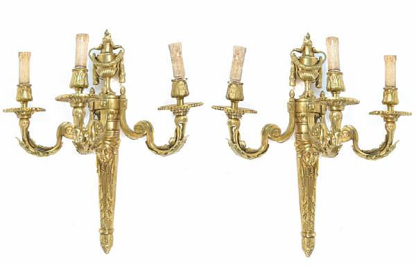 Appraisal: A pair of Louis XVI style three light sconces height