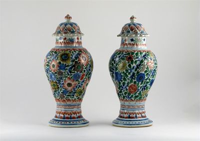 Appraisal: A good pair of Chinese spiral-moulded wucai vases the covers