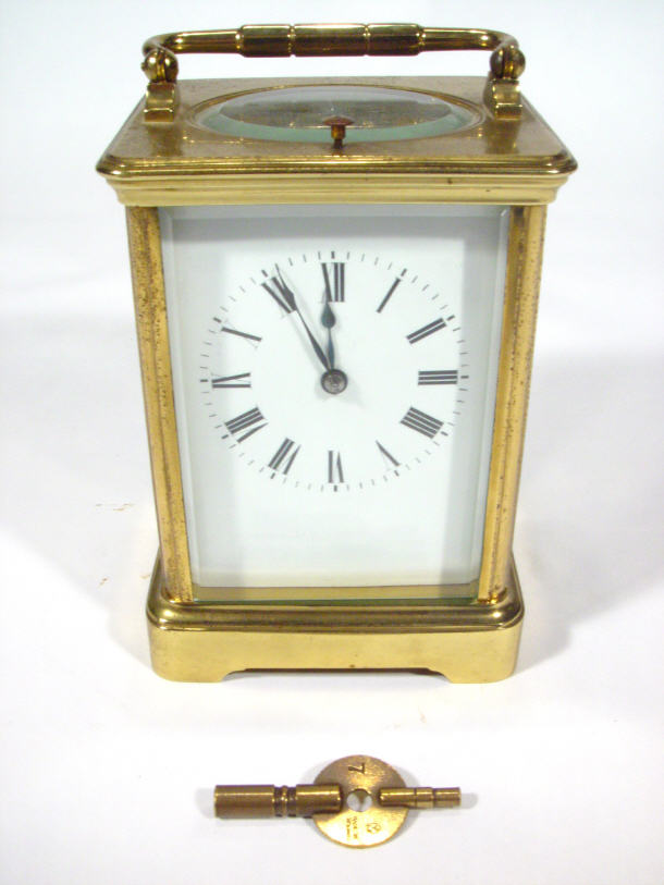 Appraisal: Victorian brass cased carriage alarm clock the movement striking on