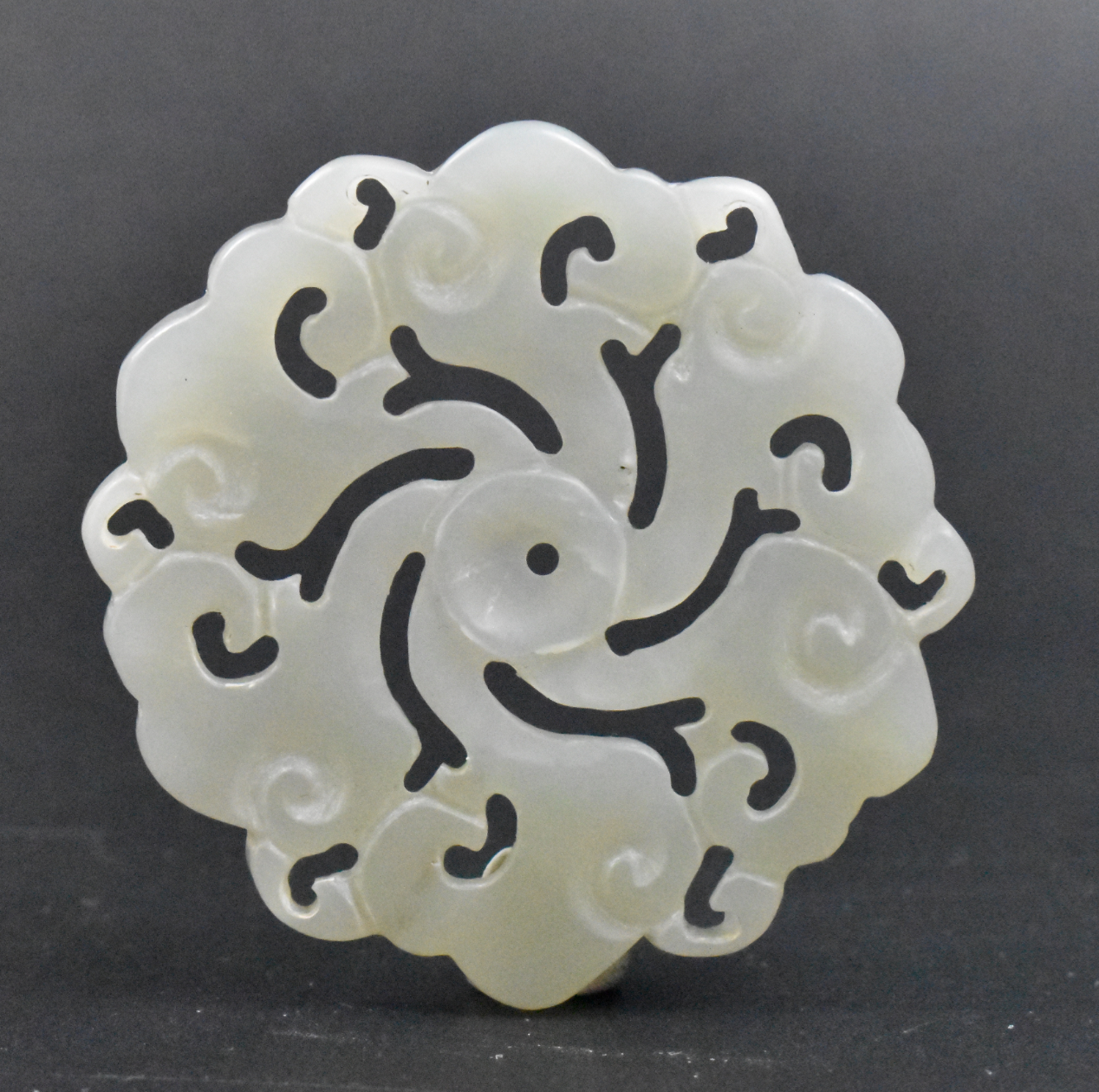 Appraisal: A circular Chinese jade carved plaque dating from the th