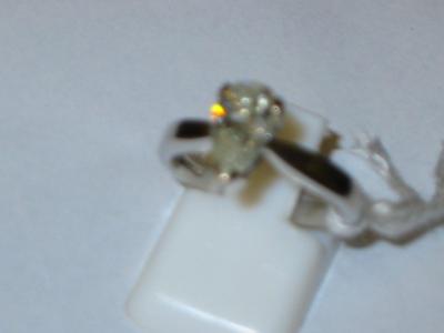 Appraisal: A SOLITAIRE DIAMOND RING comprising a pear shaped stone approximate