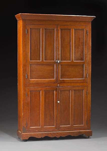 Appraisal: A Federal walnut cupboard first quarter th century The outswept