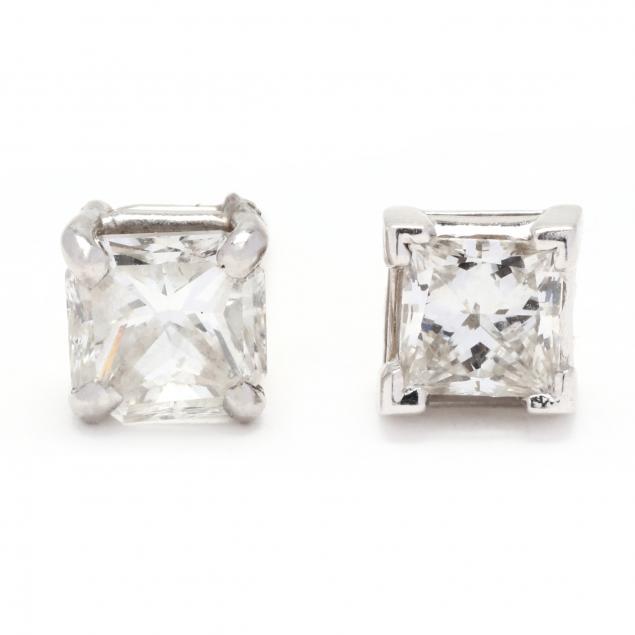 Appraisal: Two Single Diamond Stud Earrings The first a stud set