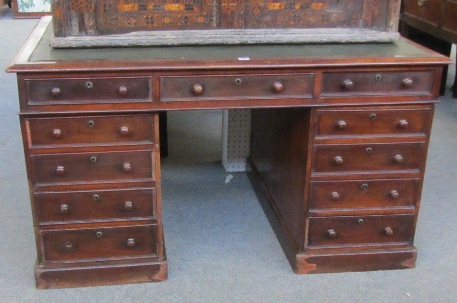 Appraisal: A th century mahogany partners desk with an arrangement of