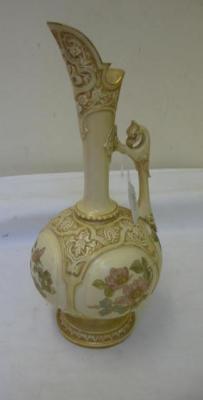 Appraisal: A ROYAL WORCESTER IVORY PORCELAIN EWER of bellied form with