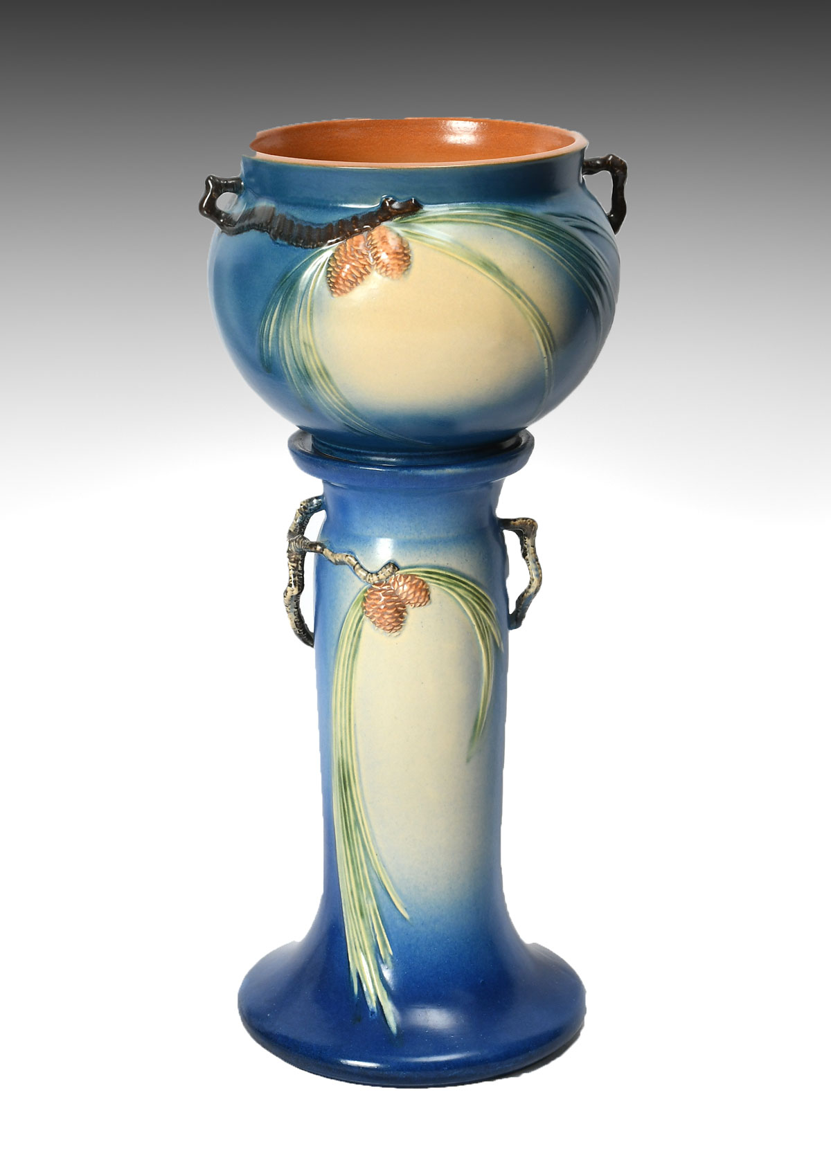 Appraisal: ROSEVILLE JARDINIERE AND PEDESTAL Roseville pinecone jardiniere pedestal in blue