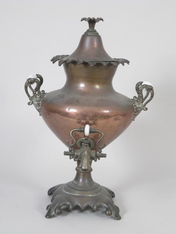 Appraisal: A Victorian copper Samovar and Cover with scroll handles