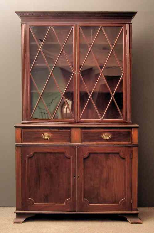 Appraisal: An Edwardian mahogany chiffonier bookcase inlaid with boxwood stringings the