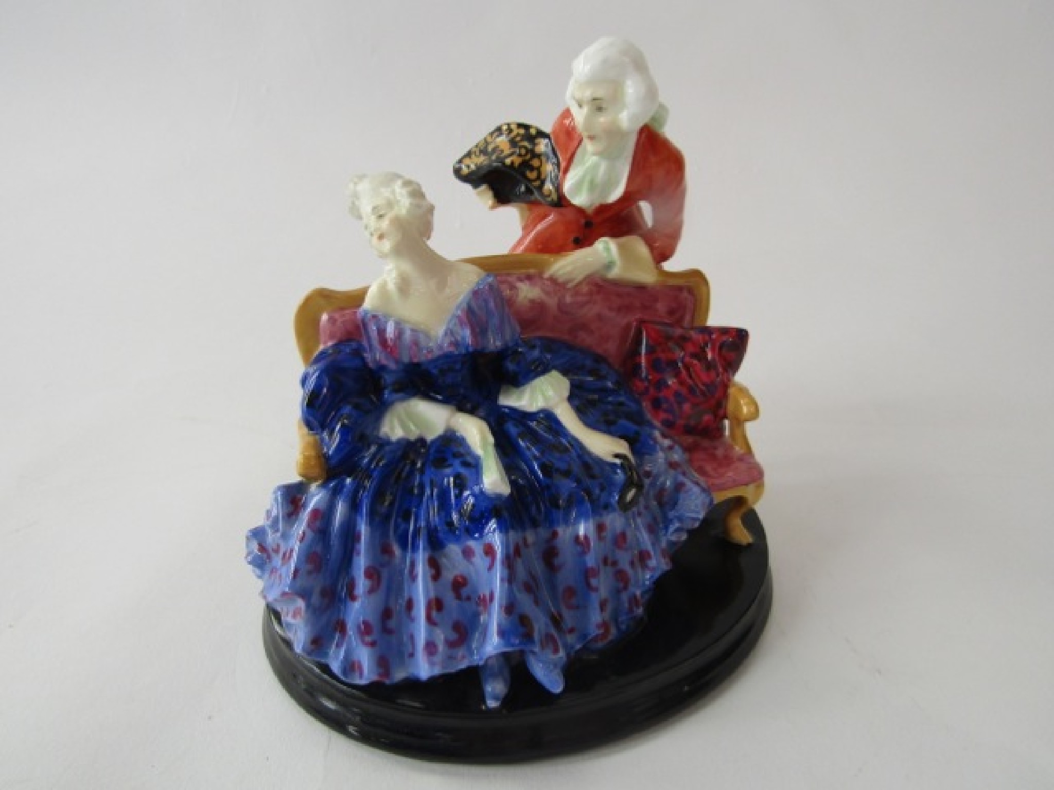 Appraisal: A Royal Doulton figure group of a lady and gentleman