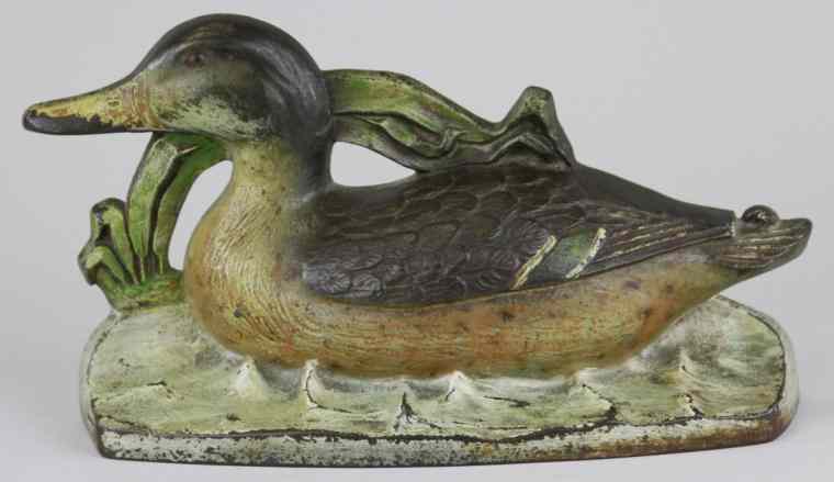 Appraisal: MALLARD DOORSTOP Wonderful casting of mallard duck swimming through the