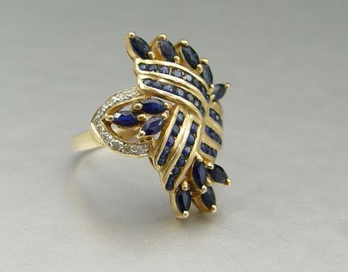 Appraisal: K SAPPHIRE AND DIAMOND RING K yellow gold ring contains