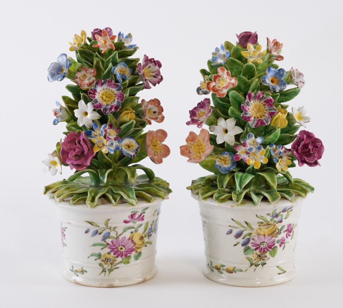 Appraisal: A PAIR OF BOW TUBS OF FLOWERS Circa The bucket-shaped