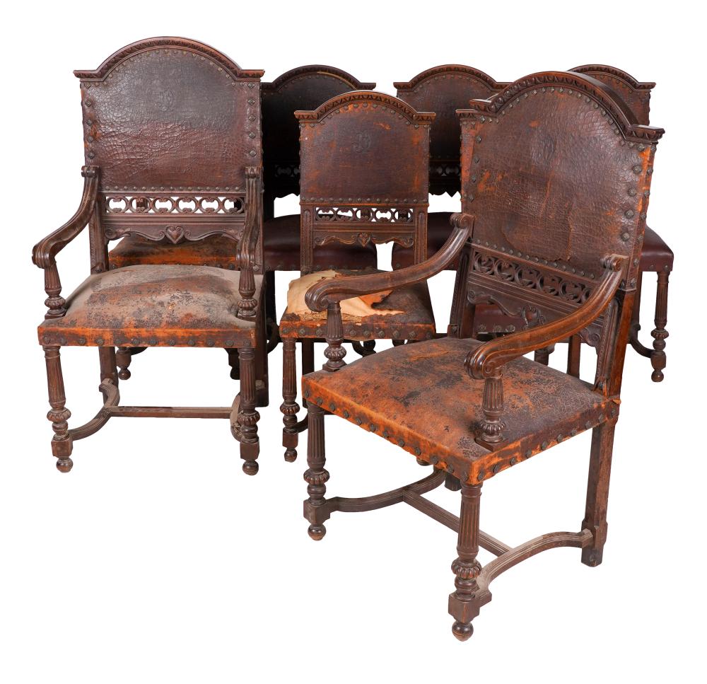 Appraisal: SET OF SPANISH BAROQUE-STYLE DINING CHAIRScarved walnut and leather comprising