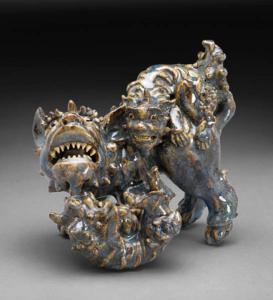 Appraisal: A Shiwan flamb glazed stoneware qilin group th Century Depicting