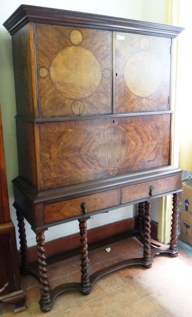 Appraisal: An inlaid mahogany escretoire with pair of cupboards over drop