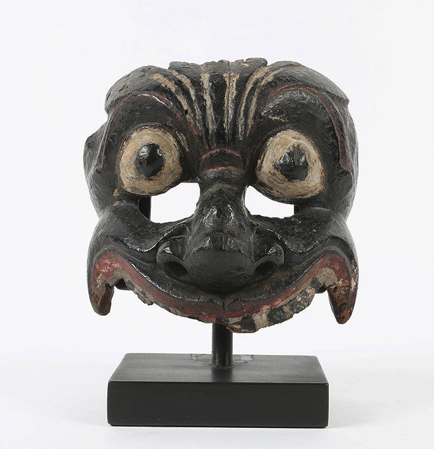 Appraisal: A CEYLON PAINTED FESTIVAL MASK with extended eyes and flared