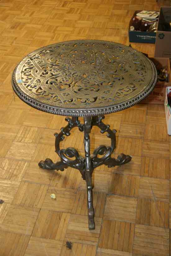 Appraisal: ROUND IRION CAFE-TYPE TABLE WITH PIERCED OPENWORK TOP - in