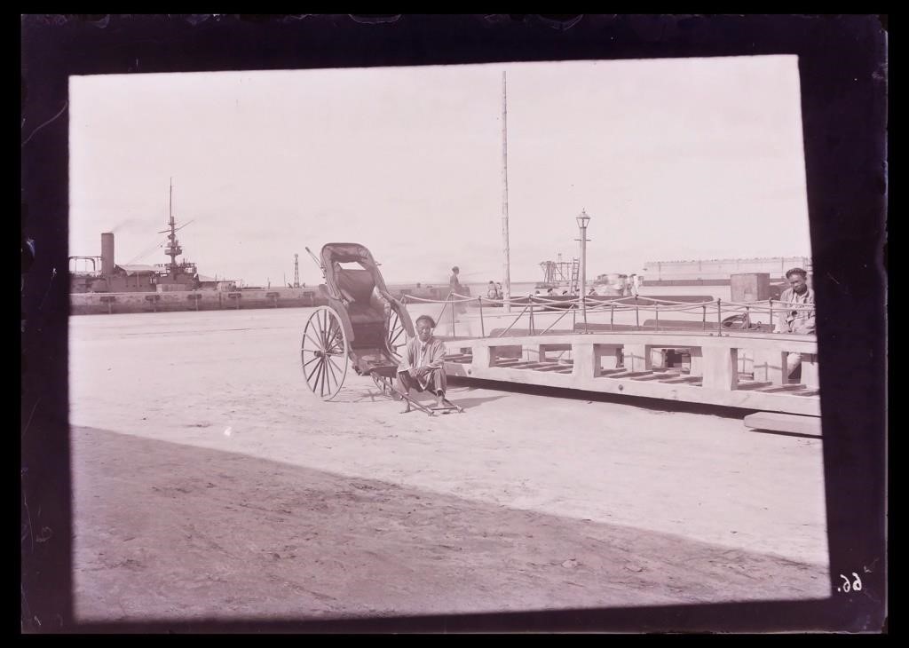 Appraisal: Circa glass negative of a weary rikshaw driver taking a