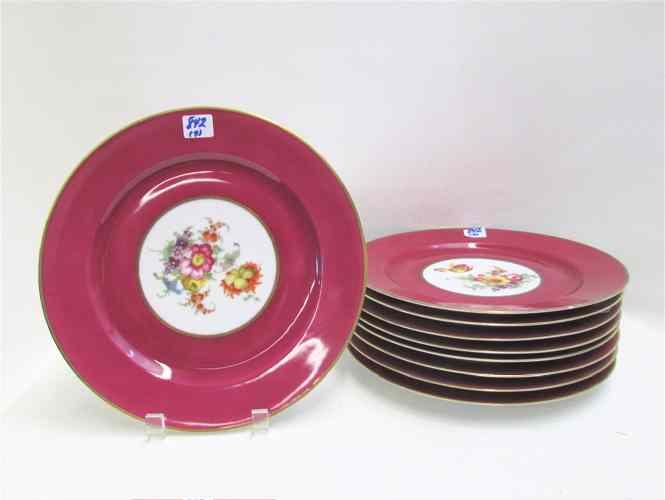 Appraisal: NINE BAVARIAN DECORATOR PLACE PLATES having '' wide cranberry red