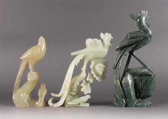 Appraisal: Three Chinese carved hardstone phoenixes each modeled as bird standing