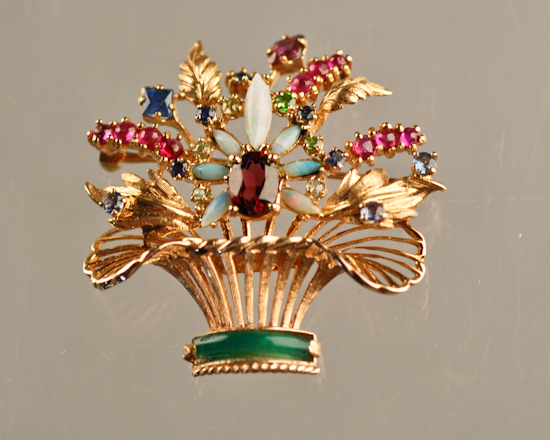 Appraisal: A Gold Ruby Sapphire Opal Jade and Garnet Brooch k