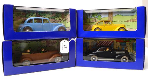 Appraisal: FOUR EN VOITURE TINTIN FIGURES FROM TINTIN COMICS RELEASED IN