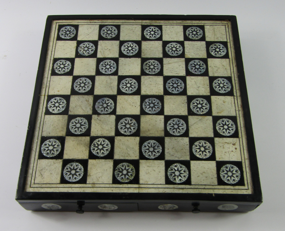 Appraisal: A Chinese soapstone chess set in an ebony and bone