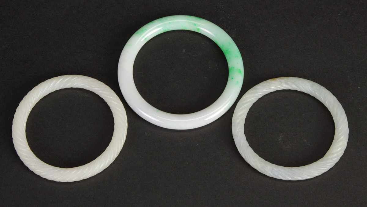 Appraisal: Carved Jade Bracelets Two have braided design Condition Excellent Dimensions