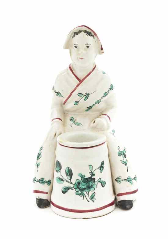 Appraisal: A French Porcelain Figural Inkwell attributed to Veuve Perrin of