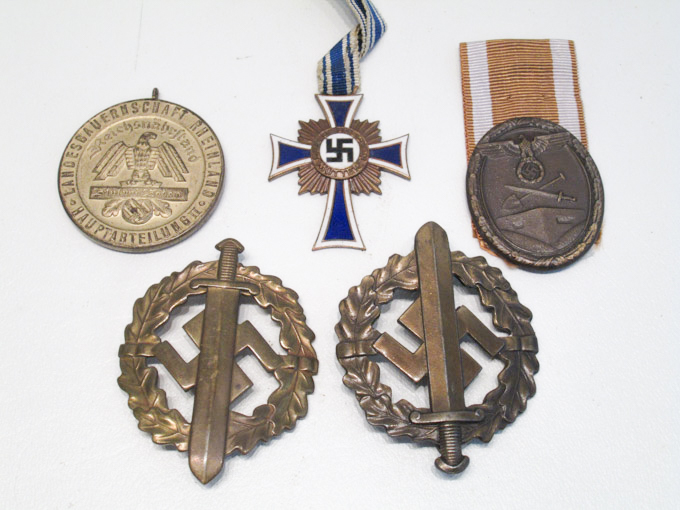 Appraisal: FIVE WORLD WAR TWO GERMAN MILITARY BADGES MEDALS including two