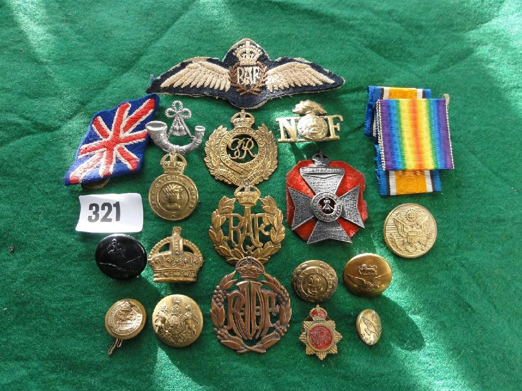 Appraisal: A small collection of military brass badges and buttons etc