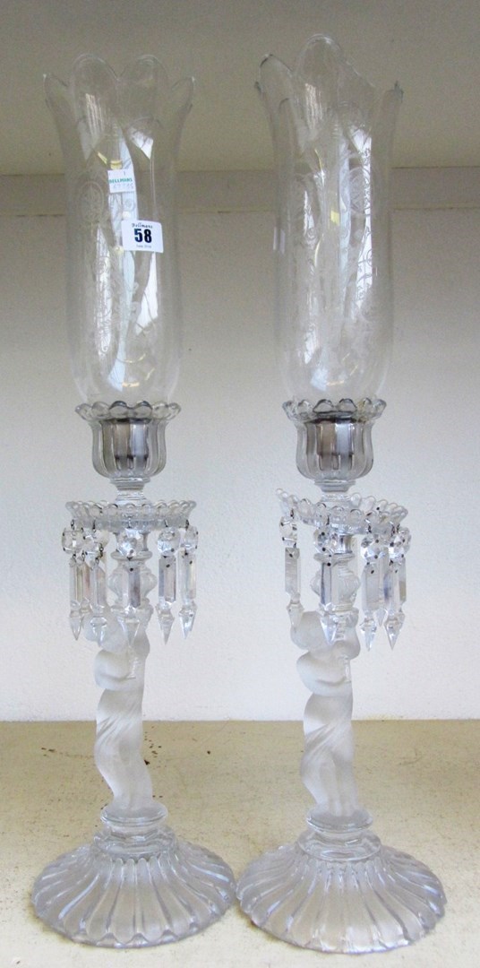 Appraisal: A pair of Baccarat frosted and clear crystal figural candlestick