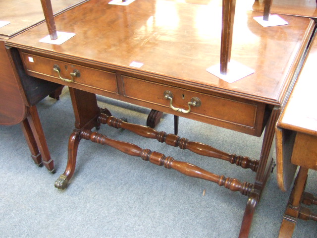 Appraisal: A late th century mahogany drop flap sofa table with