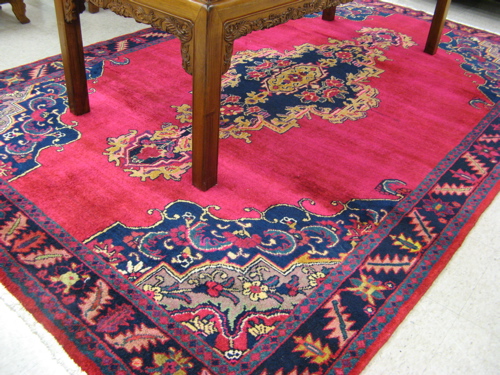 Appraisal: PERSIAN HAMADAN CARPET centering a large blue medallion on plain