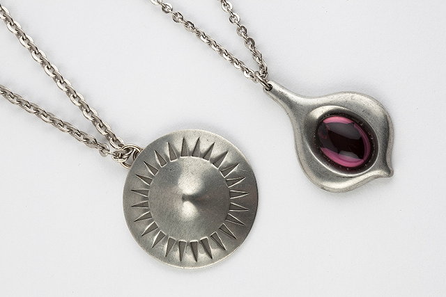 Appraisal: Two Danish pewter pendants by Jorgen Jensen the first set