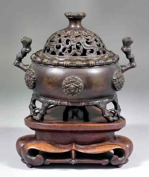 Appraisal: A Chinese two-handled bronze censer and pierced cover of bombe