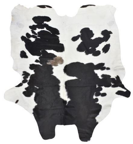 Appraisal: Large black and white cowhide largest measurement approx l w