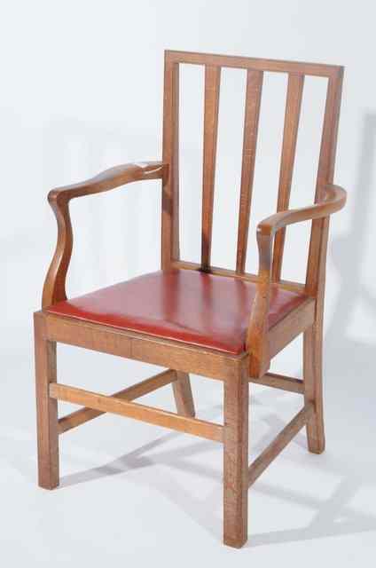 Appraisal: AN OAK RAIL BACK ELBOW CHAIR in the manner of