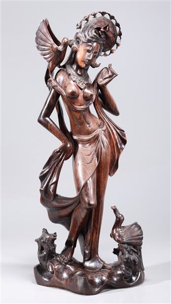 Appraisal: Indonesian hardwood carving sculpture of a female in robes with