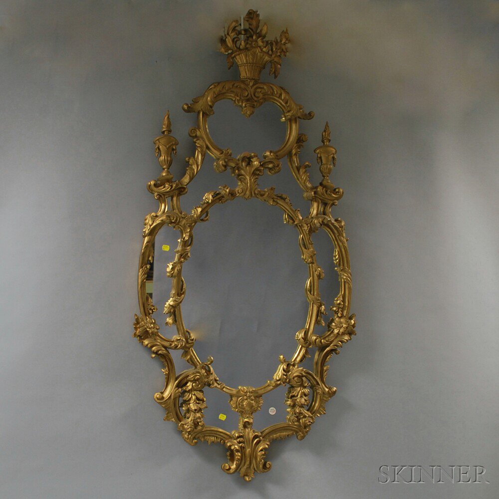 Appraisal: Gilt Rococo-style Mirror th century with mirrored cartouche panels and