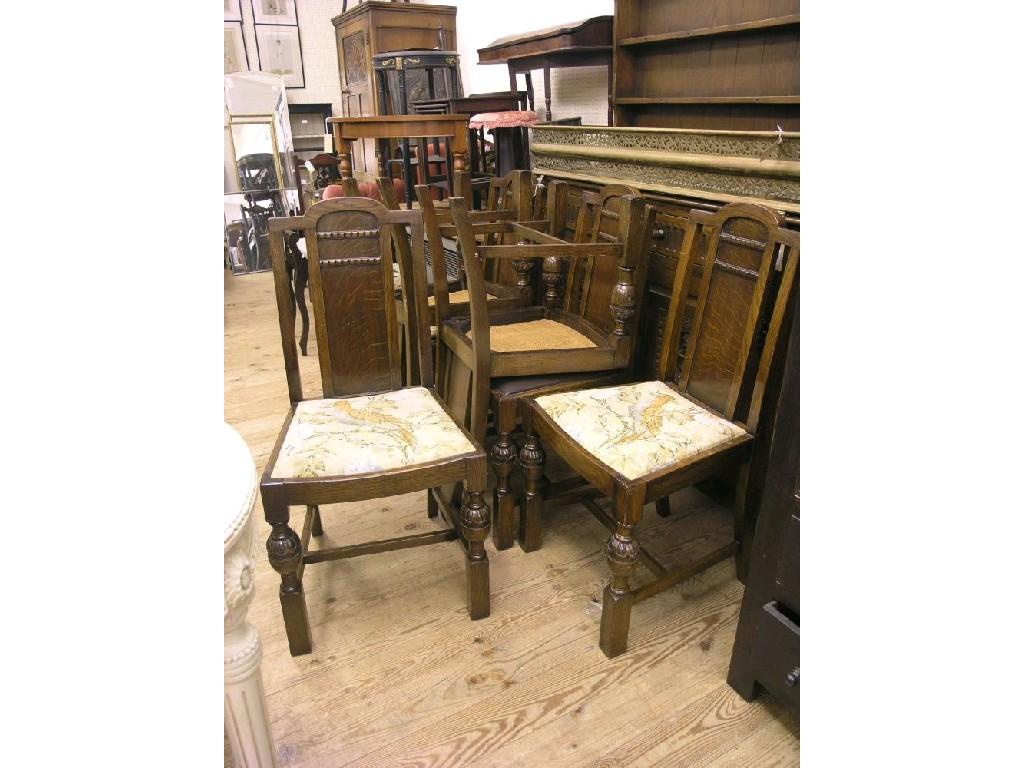 Appraisal: A set of six dark oak dining chairs panel-backs above